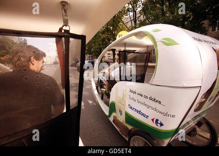 A Electro Taxi  in the City of Warsaw in Poland, East Europe. Stock Photo