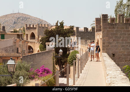People walking the old town walls, Alcudia, Mallorca, ( Majorca ), Balearic Islands, Spain Europe Stock Photo