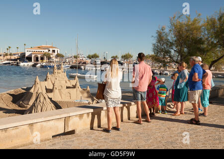 A family on holiday in Europe; Puerto Pollensa promenade, Mallorca ( Majorca ), Balearic Islands, Spain Europe Stock Photo