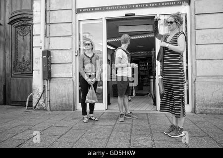 Family of three in front of a shop, paris, france, europe Stock Photo