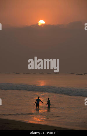 Couple bathing beach, puri, orissa, india, asia Stock Photo