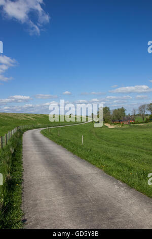 Bicycle path along the dollard route in Ostfriesland, Germany Stock Photo