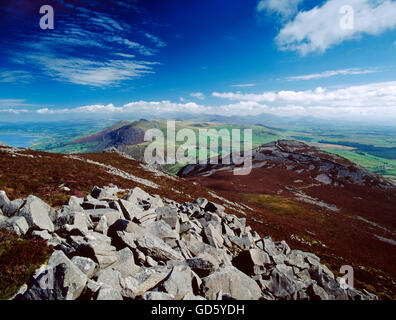 View from Yr Eifl to Tre'r Ceri hillfort, the peaks of the Snowdon Range, and the coast of Caernarfon Bay Stock Photo