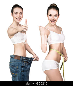 Woman in oversize jeans and with measuring tape. Stock Photo