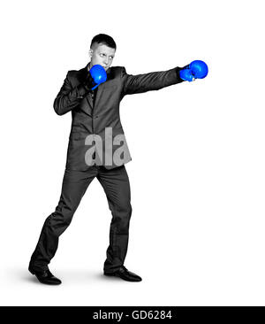 Serious businessman in sports boxing stance Stock Photo