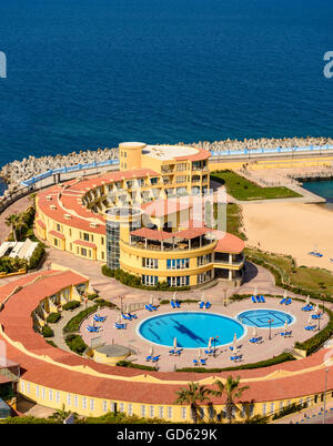 Top View of Empty Sea Hotel Swimming Pool Under Sunlight Stock Photo