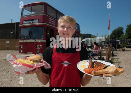Full English breakfast and beefburger with fries served from the double decker cafe bus. Hastings. East Sussex, England. UK Stock Photo