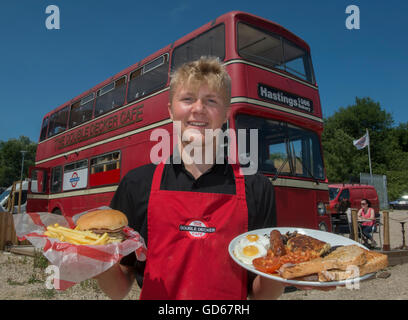 Full English breakfast and beefburger with fries served from the double decker cafe bus. Hastings. East Sussex, England. UK Stock Photo