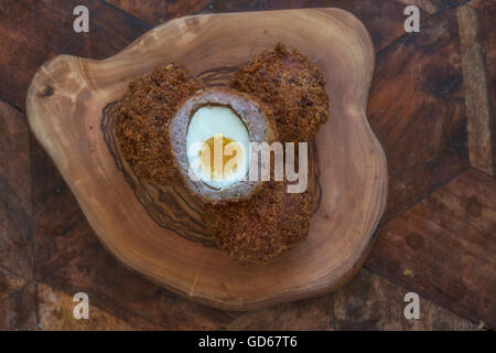 Free range scotch eggs. A hard boiled egg wrapped in pork sausage meat & breadcrumbs Stock Photo