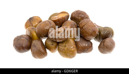 Small group of organic whole shelled roasted chestnuts isolated on a white background. Stock Photo