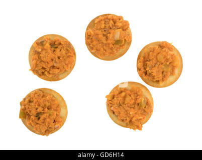 Top view of several spicy chicken salad on a butter crackers isolated on a white background. Stock Photo