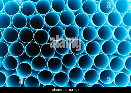 Close view of the open ends of blue drinking straws. Stock Photo