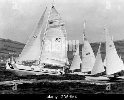 AJAXNETPHOTO. 2ND JUNE, 1984. PLYMOUTH, ENGLAND. - SINGLE HANDED TRANSATLANTIC RACE - 96 YACHTS STARTED TODAY'S OBSERVER/EUROPE 1 SINGLE HANDED ATLANTIC RACE TO NEWPORT R.I. USA. CREDIT AGRICOLE OF FRANCE WAS ONE OF THE FIRST AWAY (SAIL NR. 85) LEADING AMERICAN WALTER GREEN IN SEBAGO, (135) AND BRITAIN'S JUNE CLARK IN SWEET PEA.  PHOTO:JONATHAN EASTLAND/AJAX REF: HDD YA TRANSAT WPX 1984 Stock Photo