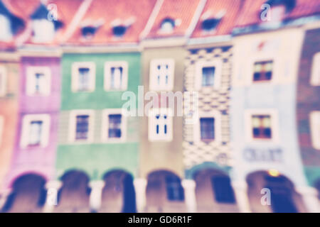 Vintage toned abstract background made of blurred colorful houses. Stock Photo