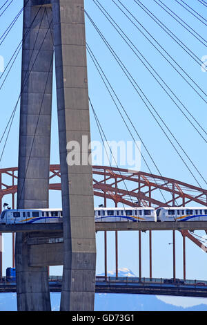 Skytrain Rapid transit bridge crossing the Fraser River from new Westminster to Surrey, British Columbia. Stock Photo