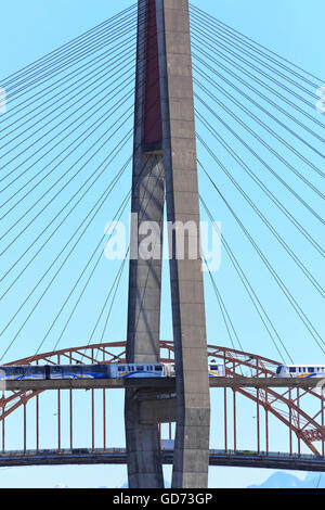 Skytrain Rapid transit bridge crossing the Fraser River from new Westminster to Surrey, British Columbia. Stock Photo
