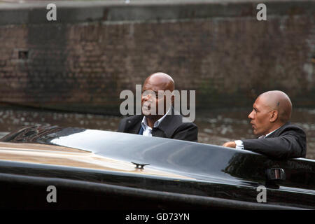 AMSTERDAM, THE NETHERLANDS ,JULY 10 2016; Famous american actor Samuel L Jackson along with a stand in actor in speedboat while Stock Photo