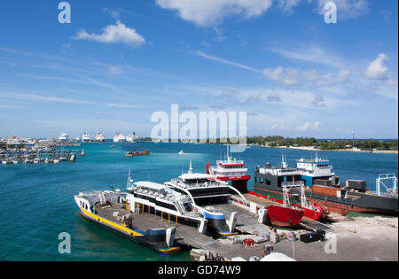 The view of ferryboat port with marina and cruise ship port in a background (Nassau, The Bahamas). Stock Photo