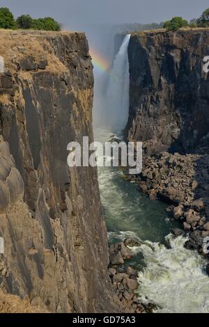 Rainbow over Victoria Falls on the Zambezi River, UNESCO World Heritage Site since 1989, Victoria Falls Stock Photo