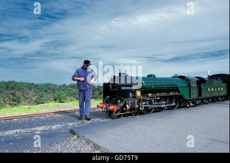 A steam train at the railway station for the Romney, Hythe and Dimchurch railway at Dungeness on the coast of Kent, England Stock Photo