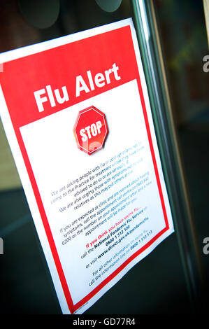 Government issued Flu Alert poster on display in UK GP Practice Stock Photo