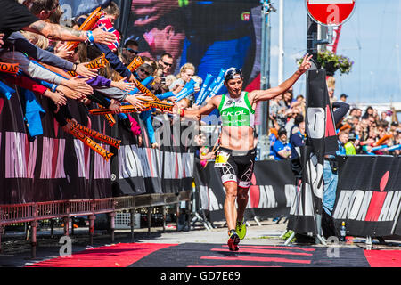 Filip Ospaly comes down the red carpet as he completes Ironman 70.3