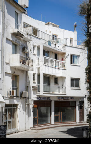 Balconies of flats over an empty shop in the city of Kyrenia on the northern coast of Cyprus. Stock Photo