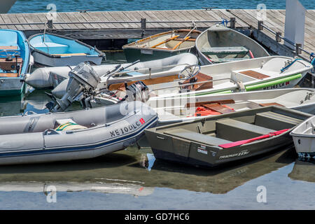 In the summer months when the harbor is full of boats, and each one has a dinghy and the wharf over-flows, and leads to a mess. Stock Photo