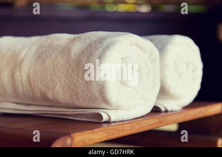 rolled bath towels at hotel spa Stock Photo