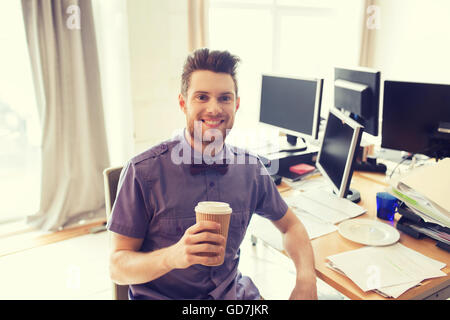 happy creative male office worker drinking coffee Stock Photo
