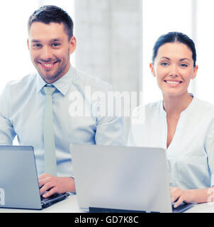group of people working with laptops in office Stock Photo