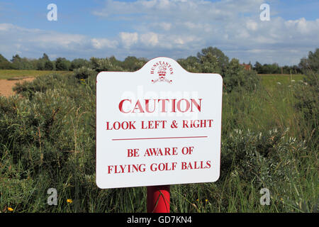 Hunstanton Golf Course, caution sign, footpath at Holme, beware of flying golf balls, warning signs, Norfolk England UK, courses Stock Photo