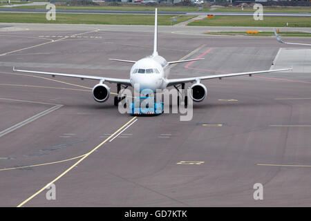 AMSTERDAM, HOLLAND - FEBRUARY 23, 2014:Just arrived plane on our way to the passenger terminal Stock Photo