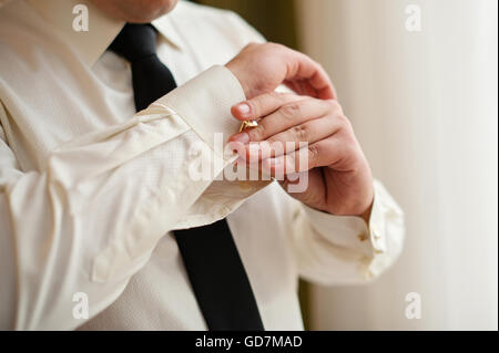 man cufflinks buttons on the sleeve shirts Stock Photo - Alamy