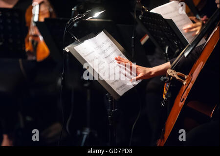 Classical music cello player on stage Stock Photo