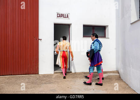 The Spanish Bullfighters enter chapel before starting bullfight, tradition ancestral and religion in the world of bullfighting, Stock Photo