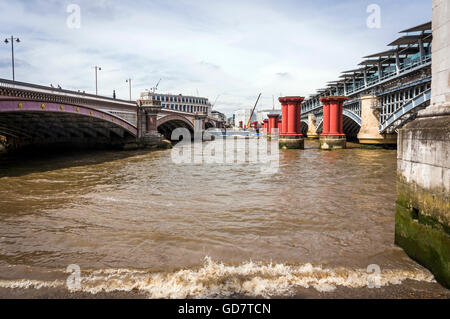 Disused Victorian plinths between the Blackfriars road and rail bridges over the River Thames, London, UK Stock Photo