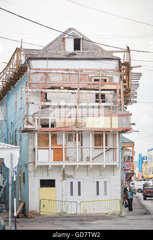 Barbados Parish Saint Michael west indies Bridgetown gabel end of building run down boarded up scaffold repair needs Stock Photo