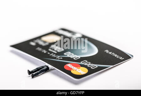 Credit card debt concept image of a man crushed under the weight of his financial debt Stock Photo