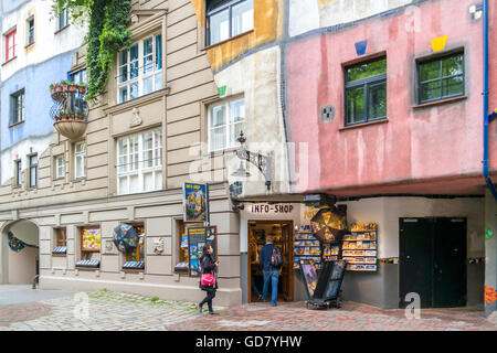 People outside tourist gift and info shop at Hundertwasser House in Vienna, Austria Stock Photo