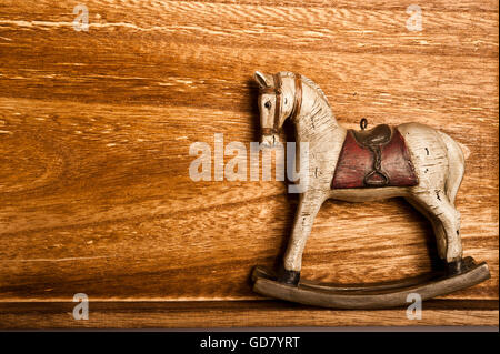 vintage rocking horse on wood Stock Photo