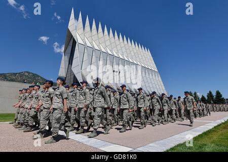 Incoming freshman students known as doolies march in formation past the chapel during lunch assembly during Basic Cadet Training at the U.S Air Force Academy July 8, 2016 in Colorado Springs, Colorado. The rigorous six-week Basic Cadet Training program acquaints cadets with military life before the start of the academic year. Stock Photo