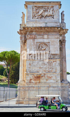 Tourists in buggy passing 4th century Arch of Constantine (Arco Di Costantino) Rome Lazio Italy Europe Stock Photo