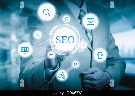 Search optimization business pointing finnger selecting seo Stock Photo