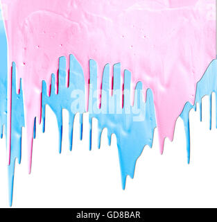pink and blue paints dripping isolated on white background Stock Photo