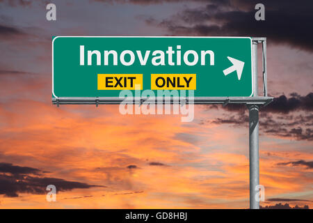 Innovation exit only freeway sign with sunrise sky. Stock Photo
