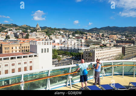 Tourists get their first view of Messina, Sicily, from a cruise ship that has just arrived in the port Stock Photo