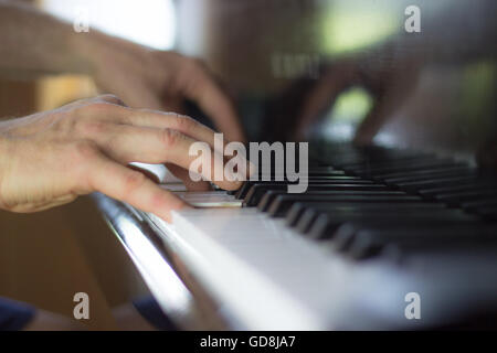 Close up of Hands Playing Piano with Selective Focus Stock Photo