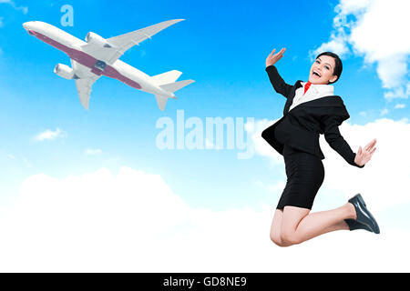 1 Indian Adult Woman Air Hostess Outdoors Jumping Stock Photo