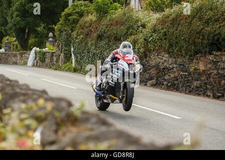 Castletown, Isle of Man, UK. 13th July, 2016. Michael Dunlop wheelies at Williams Corner- July 13. 2016 - Southern 100 Road Races, Billown Circuit, Castletown Isle of Man. Credit: Samuel Bay/Alamy Live News Stock Photo